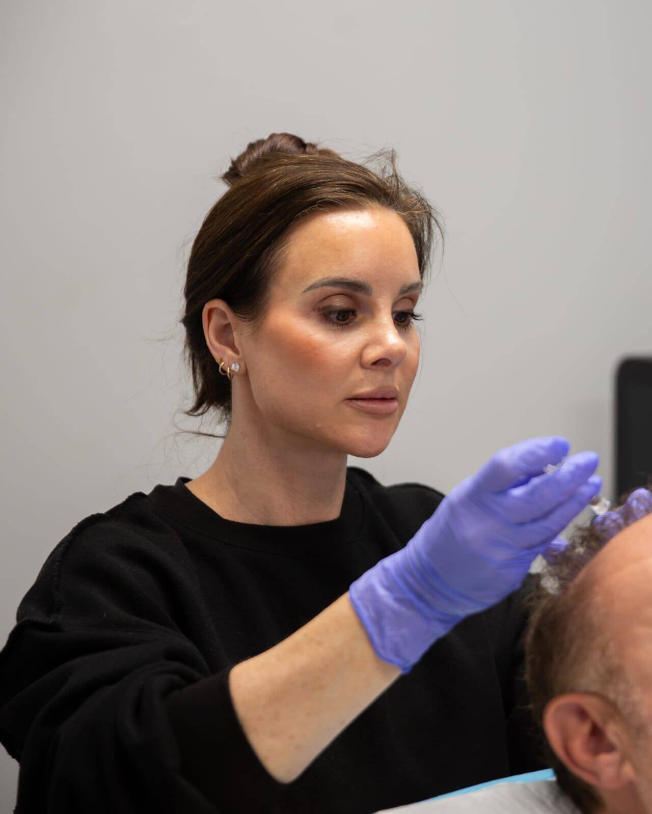 Holly Wade Esthetician at - Finger and Associates performing